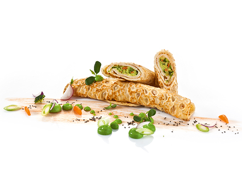 Pancakes with a vegetable filling of broccoli, carrots, peas, courgettes, leeks and celery.