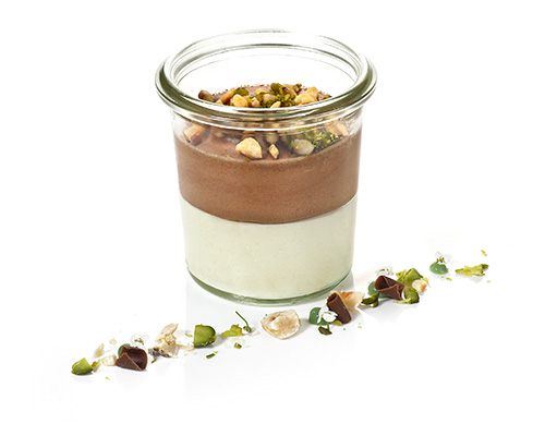 Chocolate-ginger mousse vegan chocolate and ginger mousse with candied ginger and caramelised hazelnut-pistachio topping, negative for tall jar.