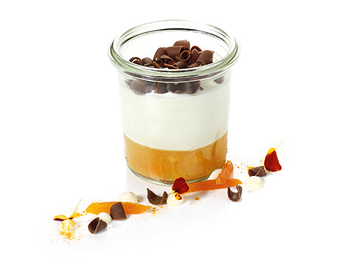 Mascarpone cream and apricot ragout with chocolate curls, negative for tall preserving jar.