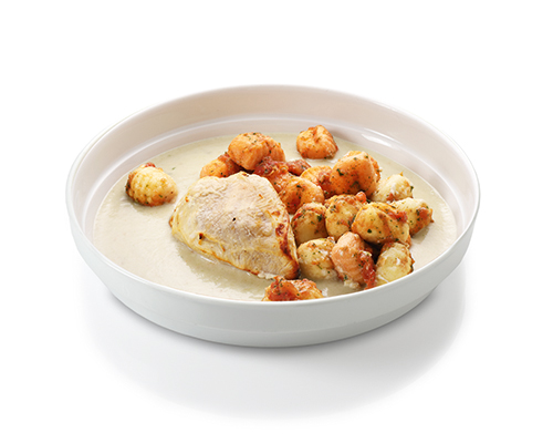 Chicken breast in gorgonzola sauce with tomato gnocchi.