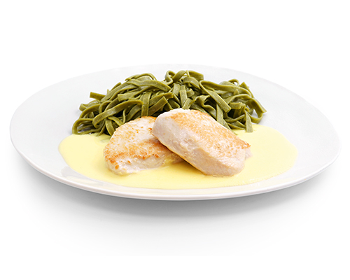 Turkey medallions in lemon sauce, with green ribbon noodles.