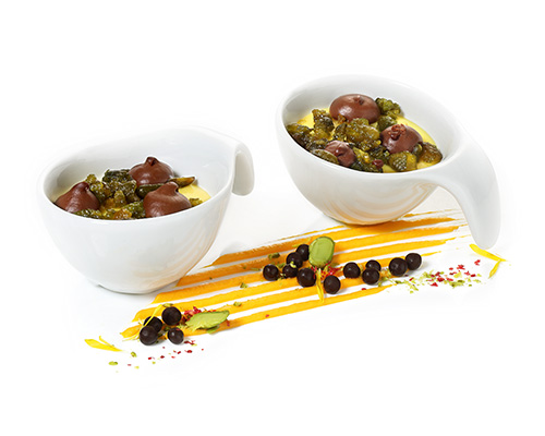 Orange cream Fruity orange cream with caramelised salted pistachios and fine chocolate cream, in a small cup.