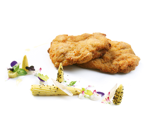 Viennese-style fried chicken made from small boneless chicken legs, breaded and fried.