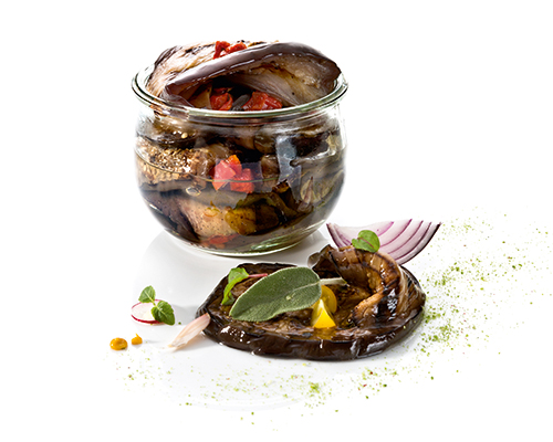 Grilled aubergines with sweet peppers, herbs and garlic, in herb-garlic oil.