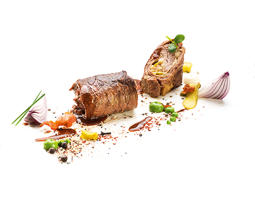 Braised beef roulade classically filled with bacon, onions, gherkins and mustard, cooked in stock.