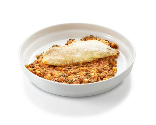 Redfish fillet on a lentil and cauliflower curry made from colourful lentils, cauliflower, chickpeas and spinach in a curry sauce.