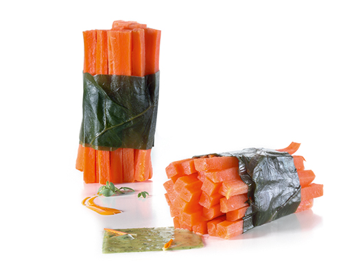 Carrot fronds wrapped in Swiss chard leaves.