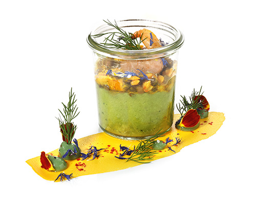 Guacamole with prawn salad and a grilled prawn, in a tall preserving jar.