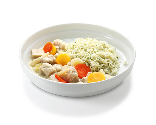 Chicken fricassee with asparagus and carrots, served with long grain rice.