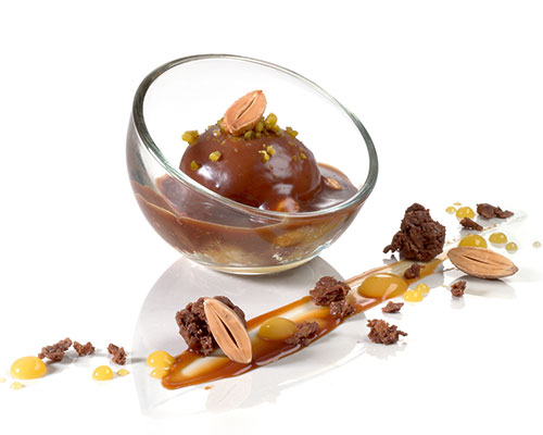 Mousse of roasted nuts with sea salt and mirabelle plums, coated with nougat sauce, negative for mini bubble glass.