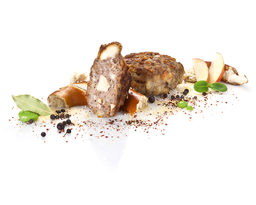 Wirtshaus-Frikadelle XL of beef and pork, rounded off with pretzels, dried apples, Gouda cheese and fried onions.