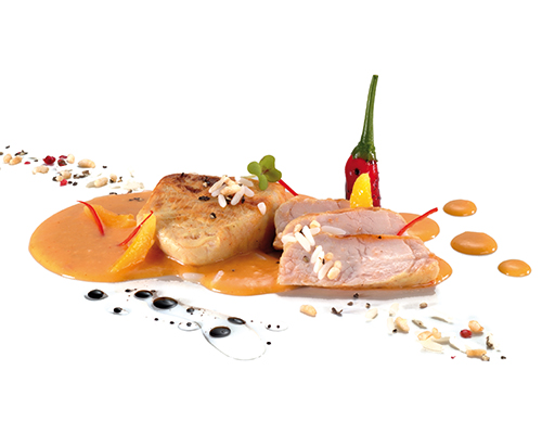 Putenmedaillons in der Pfanne gebraten, in fruchtiger Aprikosen-Chili-Sauce.