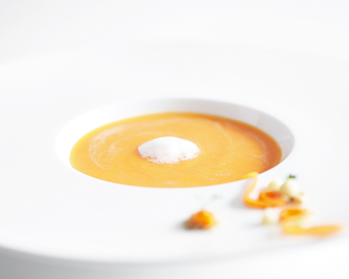 Finely pureed cream of carrot soup, without chunks.