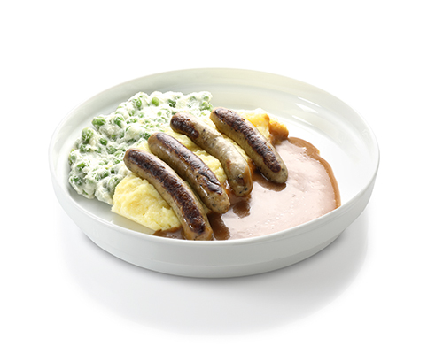 Roast sausages in brown sauce with creamed peas and mashed potatoes.