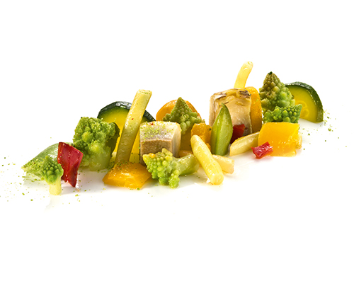 Colourful garden vegetables with peppers, courgettes, romanesco, artichokes, runner beans and wax beans.