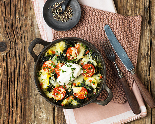 Colourful vegetable and potato gratin with carrots, potatoes, onions, kohlrabi, celery, in a cream sauce.
