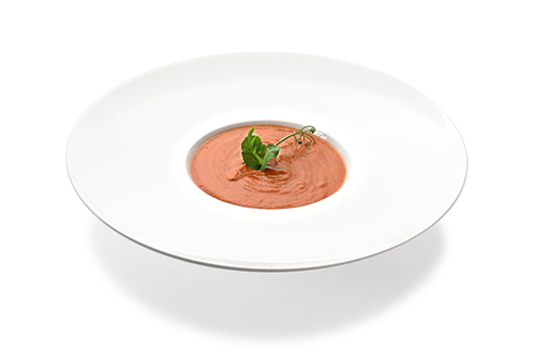 Tomatencremesuppe hochkalorisch verfeinert mit Olivenöl und mediterranen Kräutern.