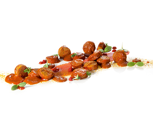 Geflügelcurrywurst Geflügelbratwurst in milder Currysauce.