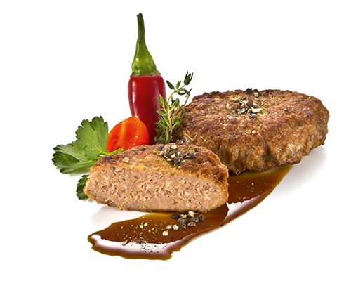 Turkey meatball fried in a pan.