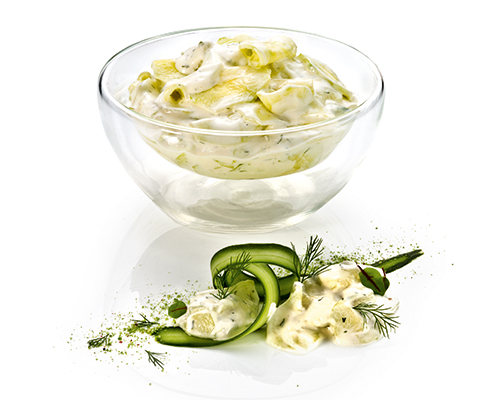 Cucumber salad in dill cream Cucumber slices in sour cream dressing with dill.