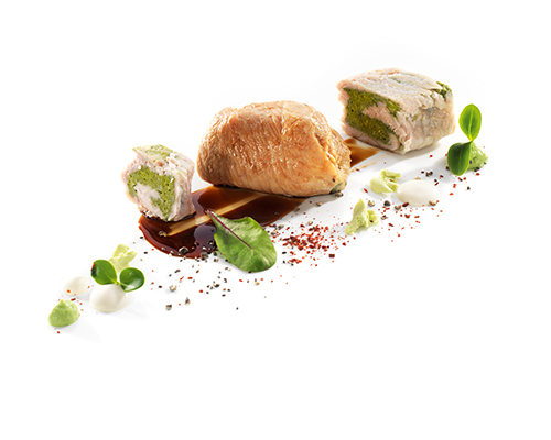 Gefüllte Putenröllchen mit Spinat, im Fond geschmort, ohne Sauce.