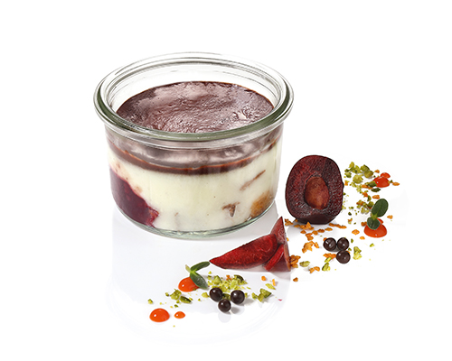 Donauwelle Sander Style cherry ragout made from Amarena and sour cherries, vanilla cream on light and dark sponge cake, with a fine layer of chocolate, in a large jar.