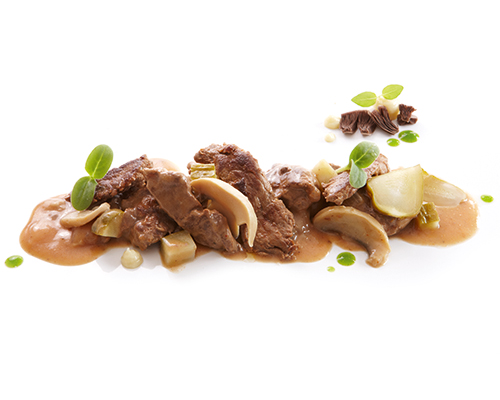 Boeuf Stroganoff made from roast beef, with mushrooms, onions and gherkins, in a cream sauce.