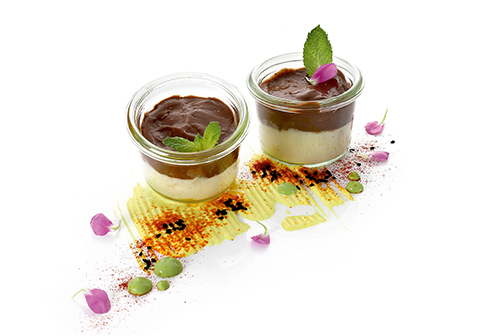 Chocolate and vanilla cream Chocolate cream on vanilla cream, in a small preserving jar.