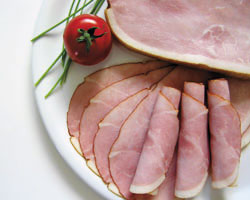 Traditional ham, light-coloured, smoked, sliced, 17 x 6 cm.