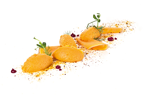 Süßkartoffelpüree abgerundet mit Kokosmilch, Curry und Zimt.