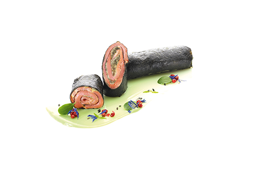 Salmon and avocado in a nori sheet Smoked salmon and avocado filling rolled up in a nori sheet.