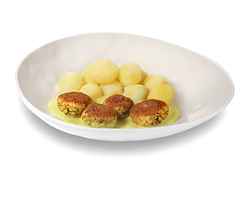 Fischklößchen in Senfsauce, verfeinert mit Sojacreme und Dijon-Senf, dazu Kartoffeln.