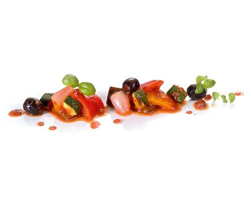 Ratatouille vegetables with black olives with aubergines, peppers, courgettes and onions, in spicy tomato butter.