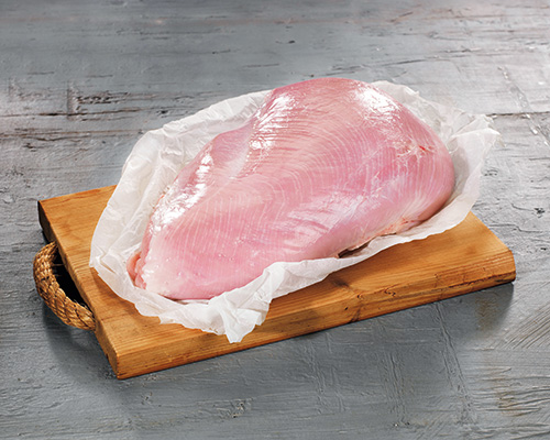 Fresh turkey breast, in one piece, sheer.