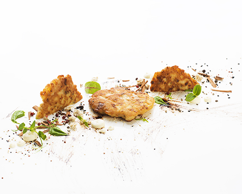 Mini piccata of turkey breast, breaded and baked in an egg and cheese coating.