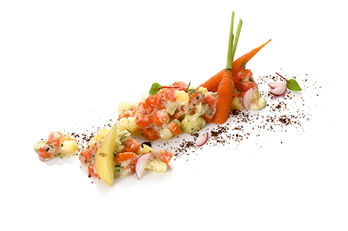 Carrot and potato vegetables in cream sauce, lightly flavoured.