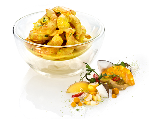 Gambas "Coco-Ginger" Riesengarnelen in gelber Kokosmarinade mit Koriander, Knoblauch und Ingwer.
