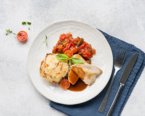 Ratatouille vegetables with aubergines, red peppers and courgettes, in a fine tomato sauce.