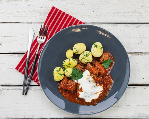 Beef goulash in a typical sauce.