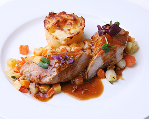 Roast pork loin cooked in stock.