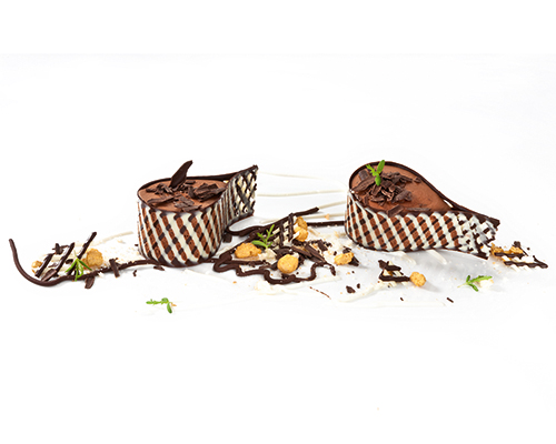 Tear of dark chocolate mousse Dark mousse made from fine dark chocolate in a chocolate lattice.