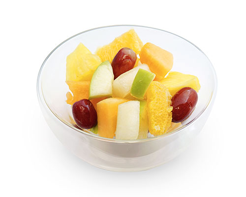 Obstsalat Harmonie ohne Fond, mit Äpfeln, Honigmelonen, Ananas, Trauben, Orangen und Zuckermelonen.