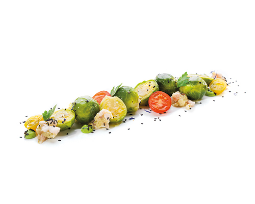 Rosenkohl verfeinert mit Speck und Zwiebeln, abgeschmeckt mit Muskat.