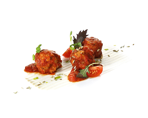 Vegan polpette al sugo vegan meatball substitute based on wheat protein in a fruity tomato and vegetable sauce.