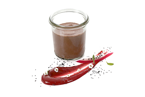 Chocolate mousse in a tall preserving jar, in a tall preserving jar.