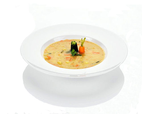 Hearty potato stew with smoked meat and fresh vegetables.