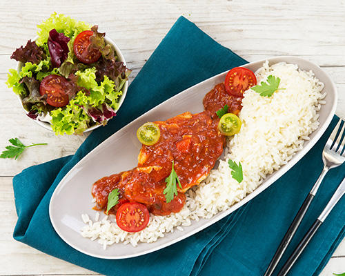 Chicken breast with roasted bacon, in tomato and paprika sauce.