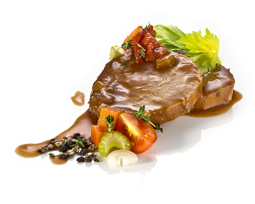 Saftiger Schweinebraten in typischer Sauce mit leichter Kümmelnote, in Scheiben geschnitten.