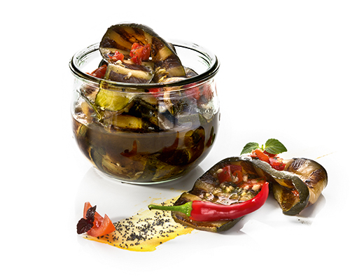 Grilled courgettes with sweet peppers, herbs and garlic, in herb-garlic oil.