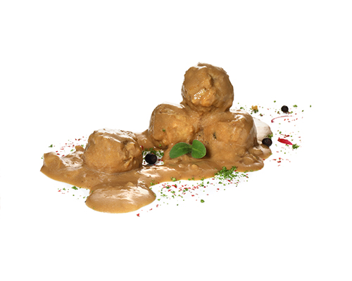 Vegan Köttbullar vegan meatball substitute based on wheat protein, in lingonberry cream sauce.